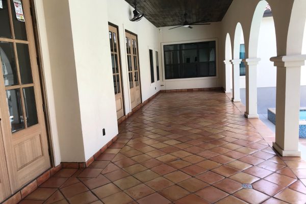 12X12" Saltillo Tile Natural with Talavera inserts installed on back porch floor.