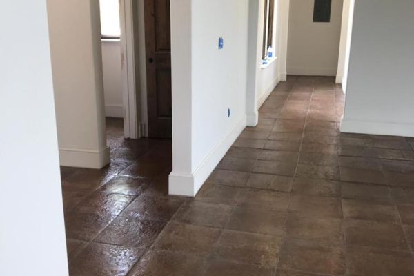 16X16" Terracotta tile in the cafe color installed on living room