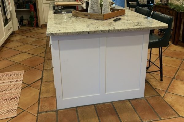 16X16" terracotta tile installed on a kitchen floor and 8X16" kitchen island framing